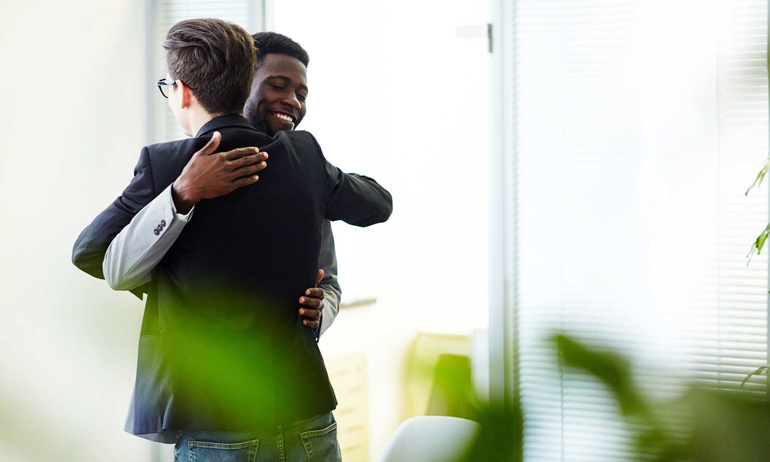 coworkers hugging